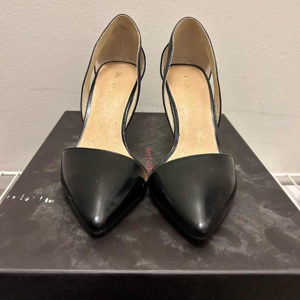 Maiden Lane black heels with cutout ankle.